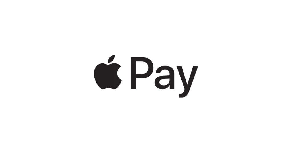 Persona realizando un pago con Apple Pay utilizando un iPhone en una terminal sin contacto.