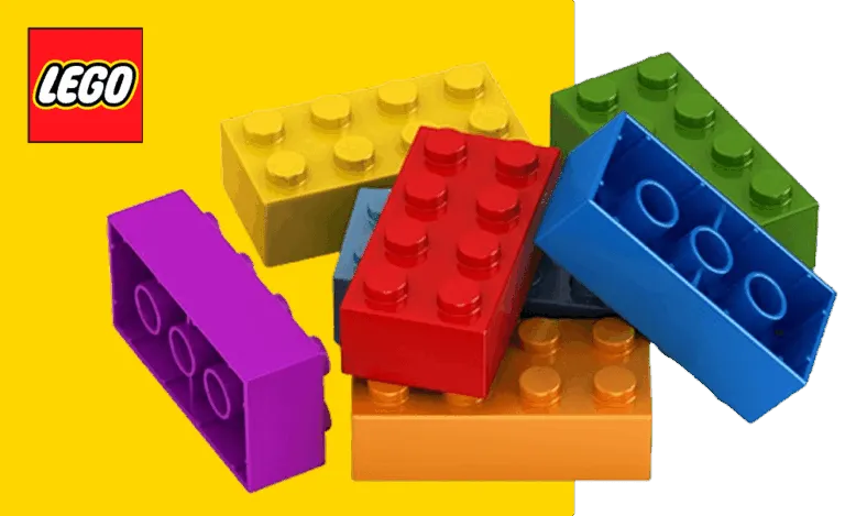Vista en corte de una pieza LEGO mostrando los tubos internos y el sistema de anclaje que permite unir los bloques con precisión.