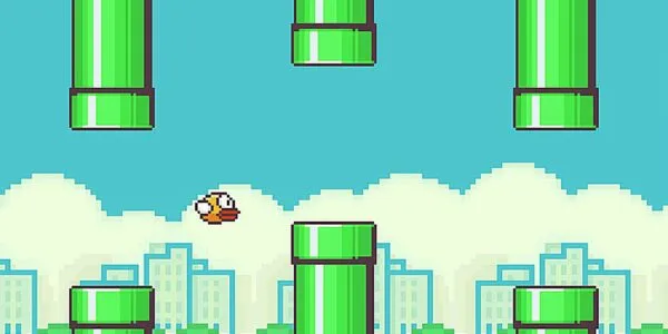 Juego inspirado en Flappy Bird mostrando un ave pixelada atravesando tubos verdes en un teléfono inteligente.
